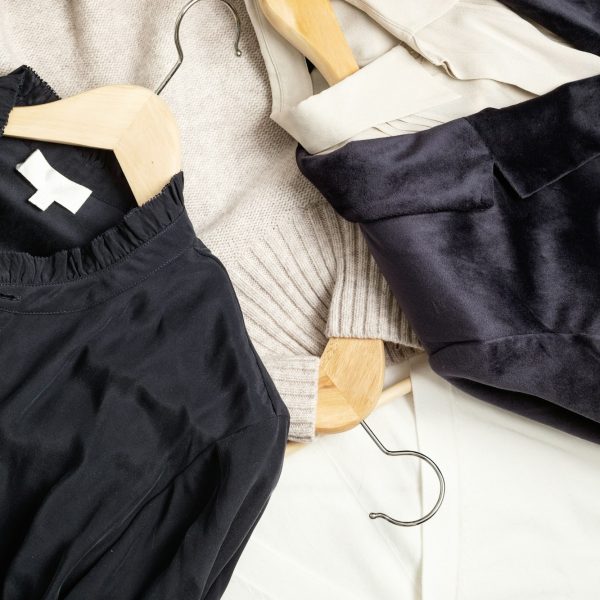 Flat lay of clothes and hangers, assortment of women's clothing